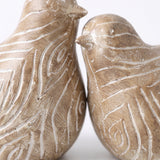 Two Bird Figurines Face Close Up