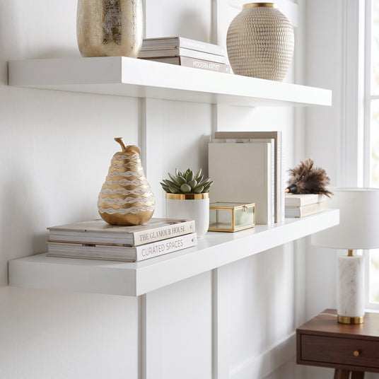 Wavy Pear Sculpture On White Shelf