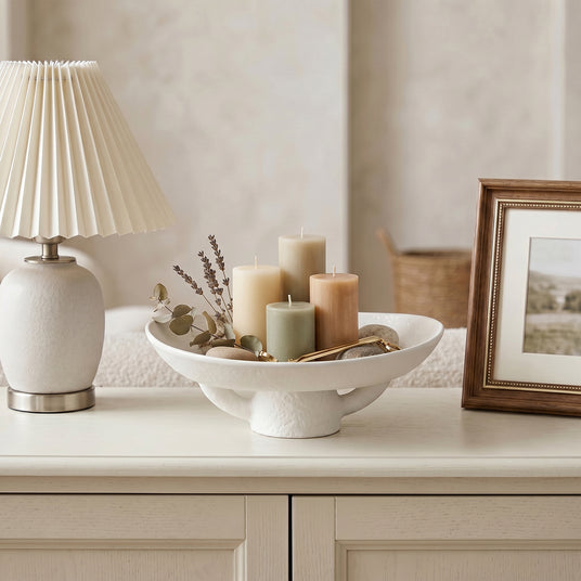 White Pedestal Bowl With Candles On Table