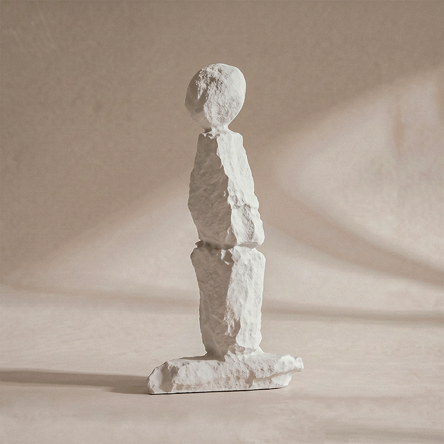 White stone textured abstract human figurine