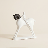 abstract black and white horse and rider sculpture
