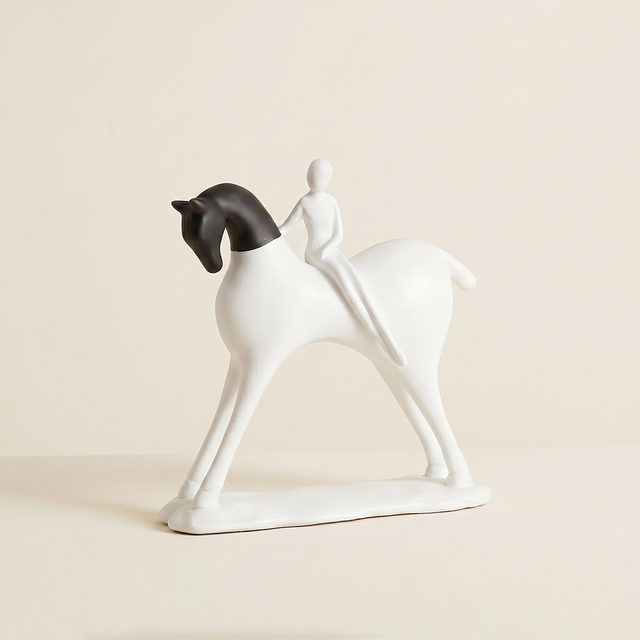 abstract black and white horse and rider sculpture