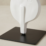 base detail of white cello sculpture