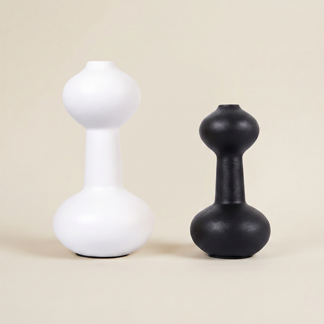 black and white curvy vases on neutral background