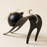 black cat sculpture curled tail back view