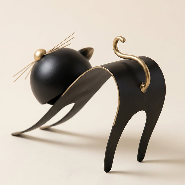 black cat sculpture curled tail back view