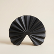 black fan pleated ceramic decor on beige