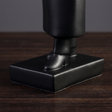 black figurine base and shoes detail
