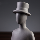 black figurine top hat head detail