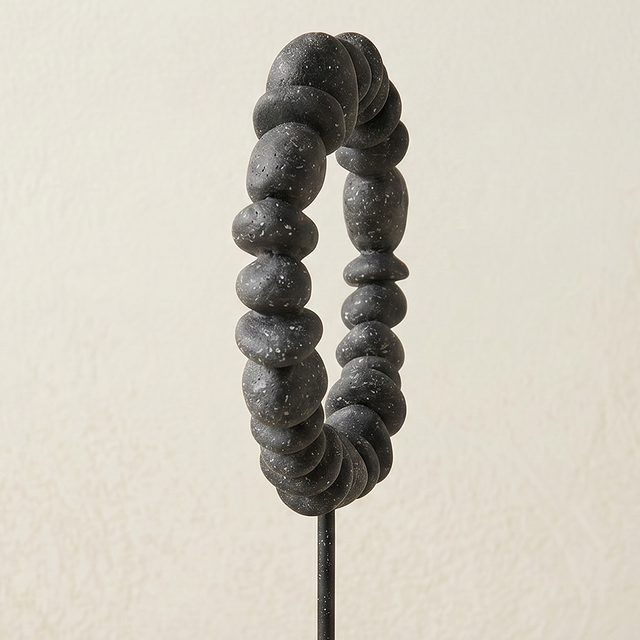 black stone ring sculpture side view
