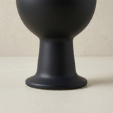 black vase base close up