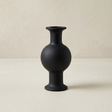 black vase on beige background