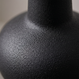 black vase textured surface macro detail