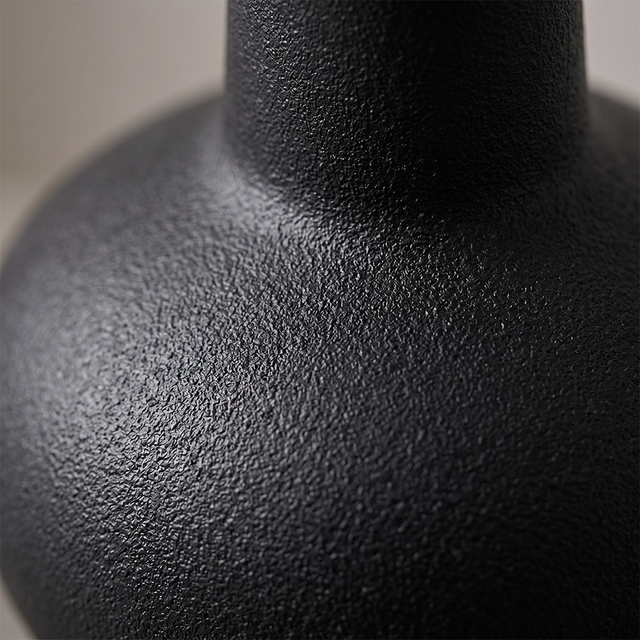 black vase textured surface macro detail