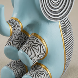 blue resin elephant legs gold detail