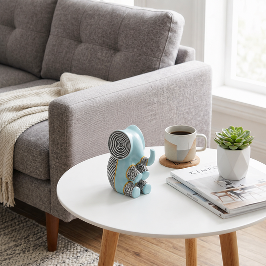blue resin elephant on round coffee table