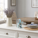 blue resin elephant on white dresser