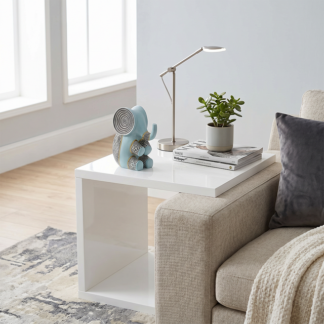 blue resin elephant on white side table