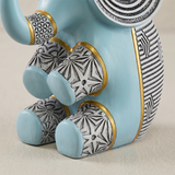 blue resin elephant patterned legs close up
