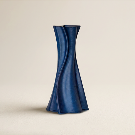 blue spiral ribbed twisted vase on beige