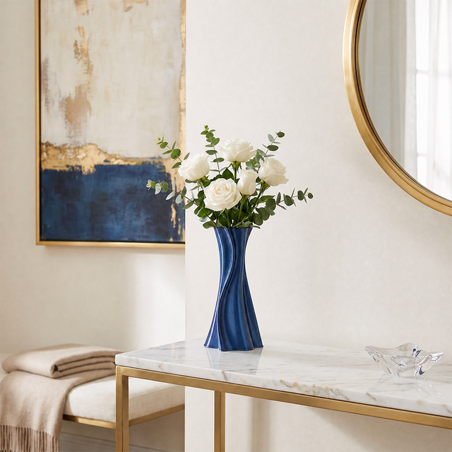 blue twisted vase with white roses on console