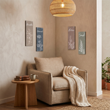 botanical signs on wall above beige reading chair