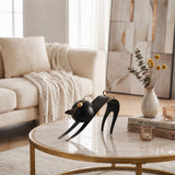cat sculpture on marble coffee table