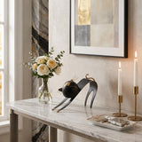 cat sculpture on marble console table