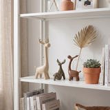 ceramic deer display white bookshelf
