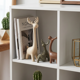 ceramic deer with books in cubby