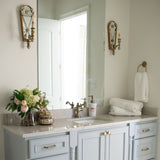 ceramic dispenser bottle on the blue washbasin