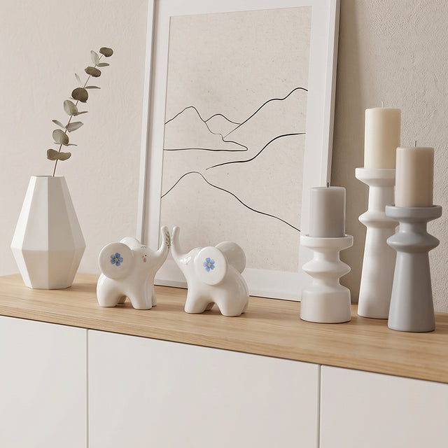 ceramic elephants on wooden cabinet top
