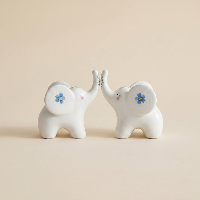ceramic elephants touching trunks front view