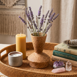 ceramic vase with lavender on wicker tray
