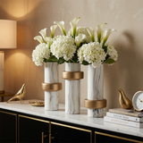 ceramic vases with hydrangeas on sideboard