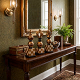 chess piece decor on dark wood console table