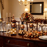 chess piece decor on dining buffet with autumn decor