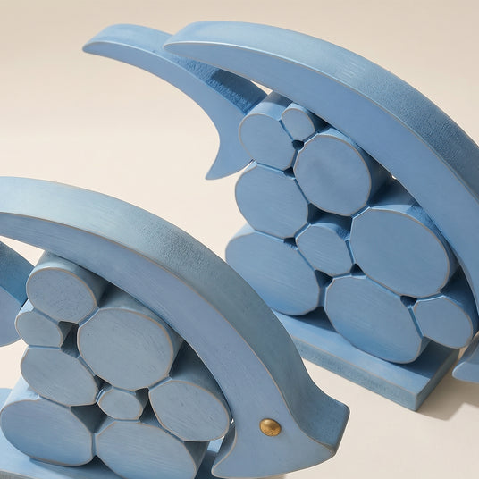 close up of blue wooden dolphin figurine bodies