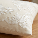 close up of cream embroidery vine and flower