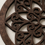 close up of dark wood cutout wall decor