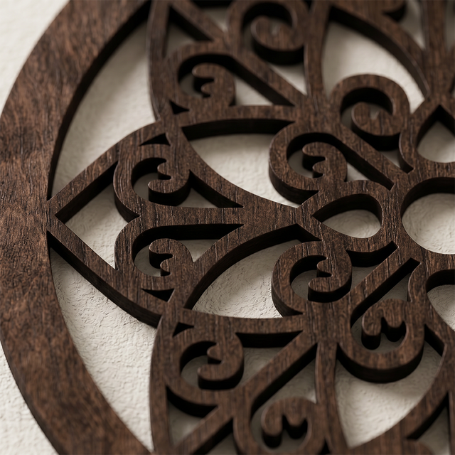 close up of dark wood cutout wall decor
