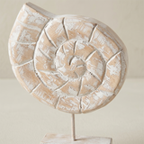 close up of distressed wood seashell figurine