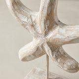 close up of distressed wood starfish figurine