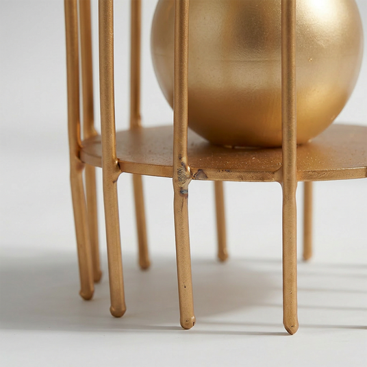 close up of gold metal stand base and legs