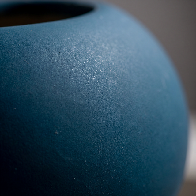 close up of matte blue ceramic vase texture