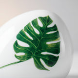 close up of monstera leaf print on ceramic