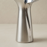 close up of silver vase body and bottom