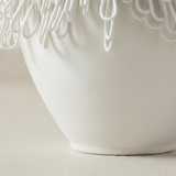 close up of white ceramic vase body and base