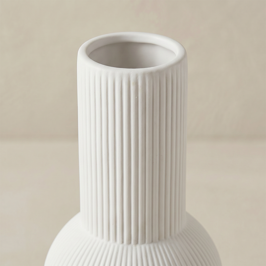 close up of white ribbed vase neck and rim