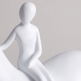 close up of white rider figurine on horse